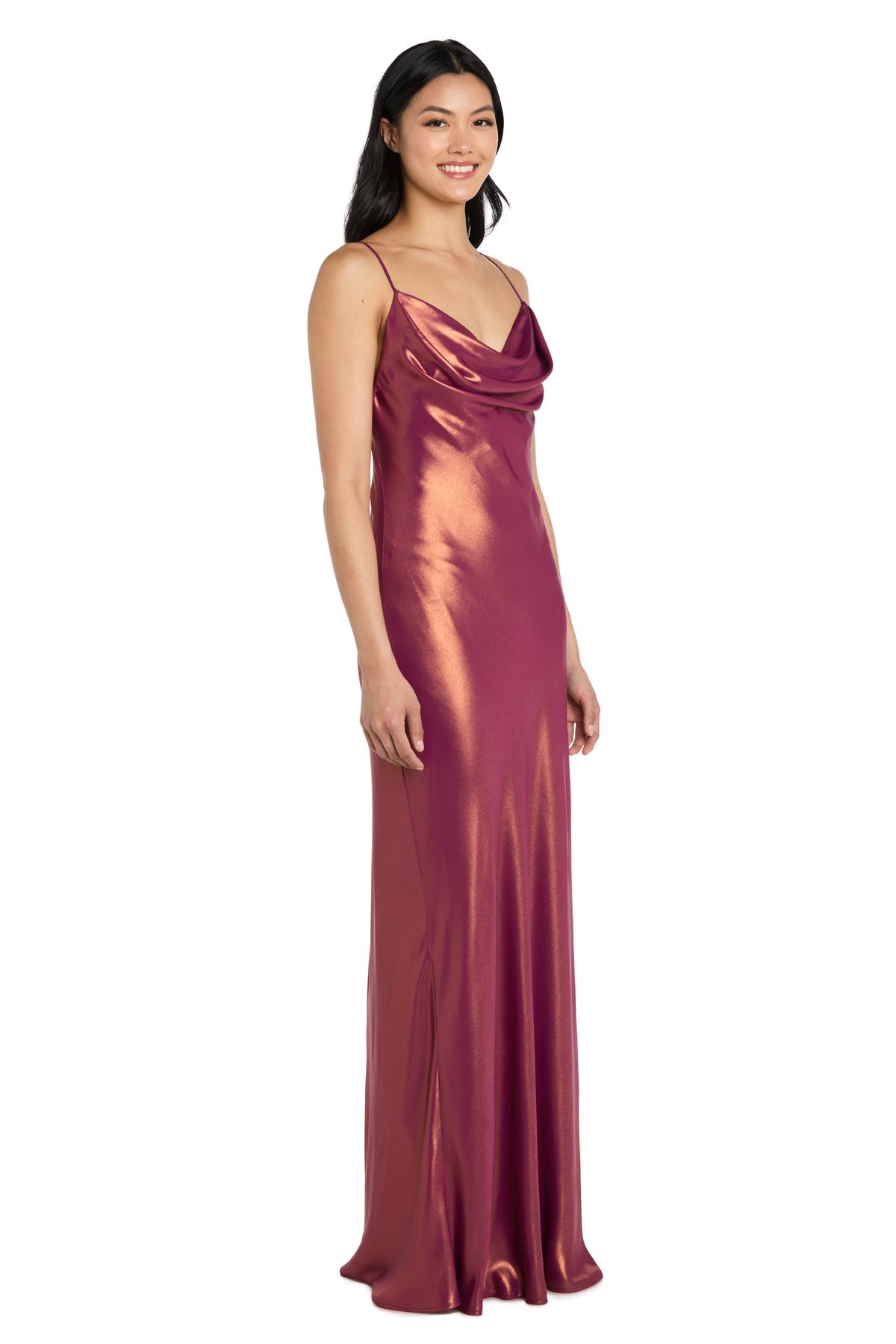 Woman wearing the Cowl-Neck Long Satin Formal Dress (Morgan 14010), a sleeveless metallic rose gown with thin straps and a draped neckline, standing against a plain white background.